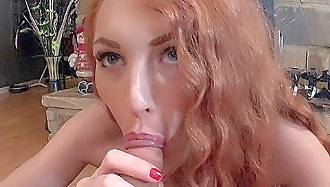 Redhead in a skimpy dress sucks and gets cumshot in her mouth