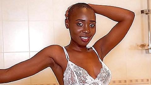 Sexy ebony babe in a sexy black dress with a sexy skirt