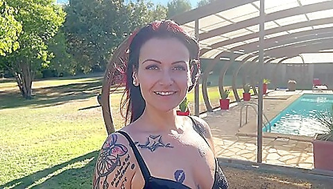 A redhead babe is having two cocks in her mouth and face