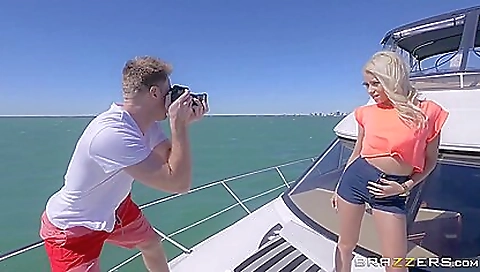 Blonde with tattoos on her back and ass on a nice night