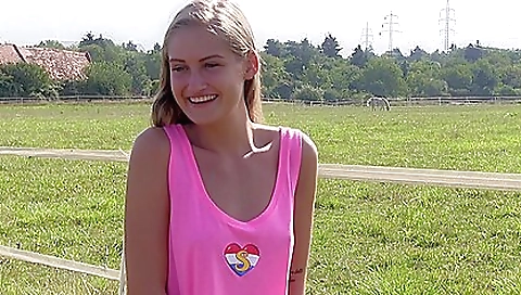Tattooed summer teen walking on the beach in the sunset