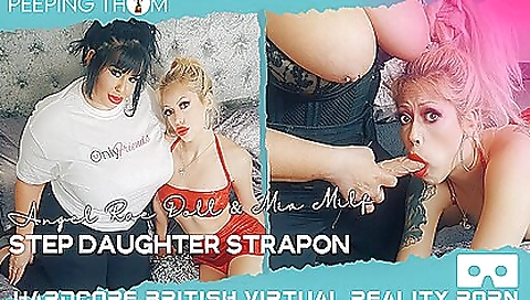 Stepmom and her stepdaughter are having a nice strap-on sex