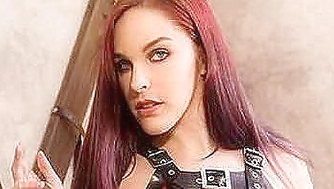 Hardcore video features a redhead stuck in a cage in a vr world