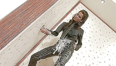 Busty brunette in sexy face mask fucks with a dildo