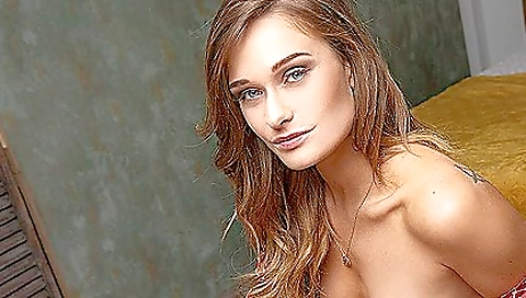 Sexy brunette in a black dress shows off her natural tits 001