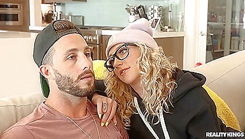 Hot blonde in sexy stockings is on the bed being fucked