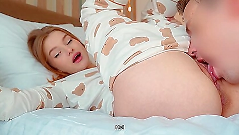 Redheaded teen plays with her hair in a porn video