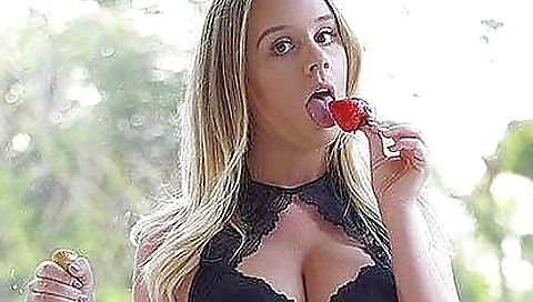 Busty blonde woman is in doggy pose and in stockings